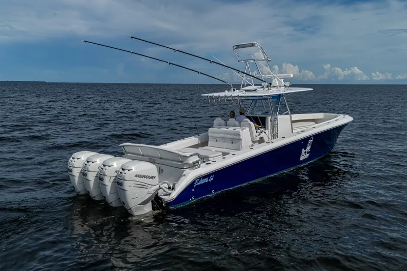 Slide: The Image of 2015 Bahama 41 boat on open water, featuring sleek design and powerful engines. - 28