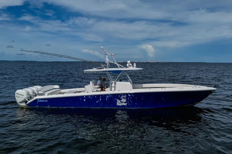 Slide: The Image of 2015 Bahama 41 boat on open water, featuring sleek design and fishing rods. - 29