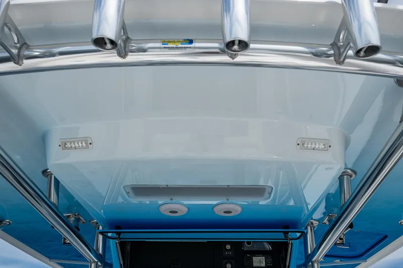 Slide: The Image of 2015 Bahama 41 boat with four engines cruising on open water. - 35