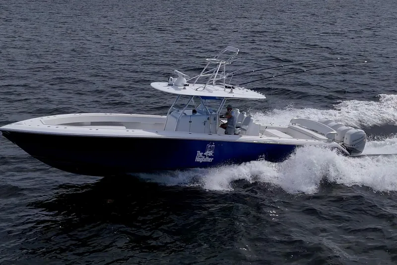 Slide: The Image of 2015 Bahama 41 boat cruising on open water with powerful engines. - 40