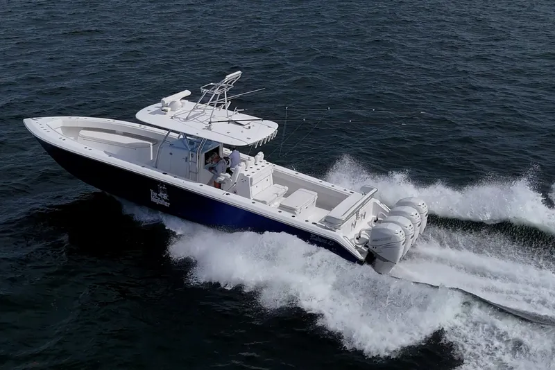 Slide: The Image of 2015 Bahama 41 boat cruising on open water, showcasing sleek design and powerful performance. - 41