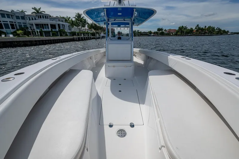 Slide: The Image of 2015 Bahama 41 boat on water, featuring spacious deck and sleek design. - 5