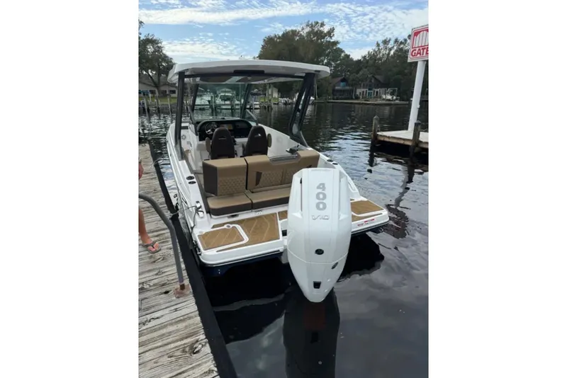 Slide: The Image of 2025 Monterey Elite 27 OB boat docked, featuring a powerful 400 V10 engine. - 26