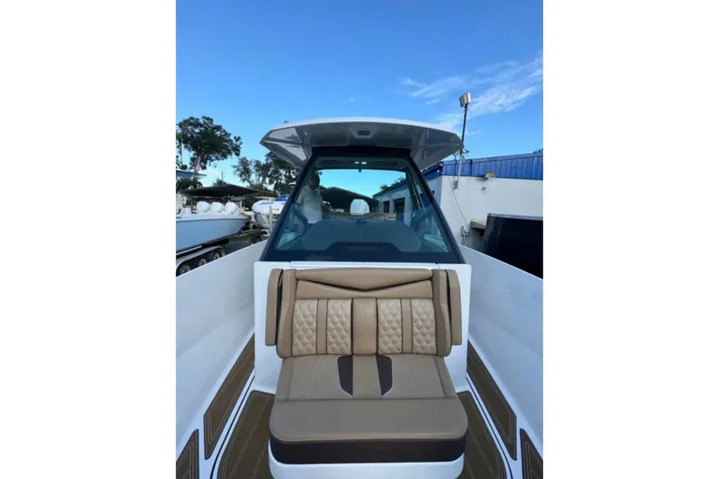 Slide: The Image of 2025 Monterey Elite 27 OB boat with luxurious seating and sleek design. - 37