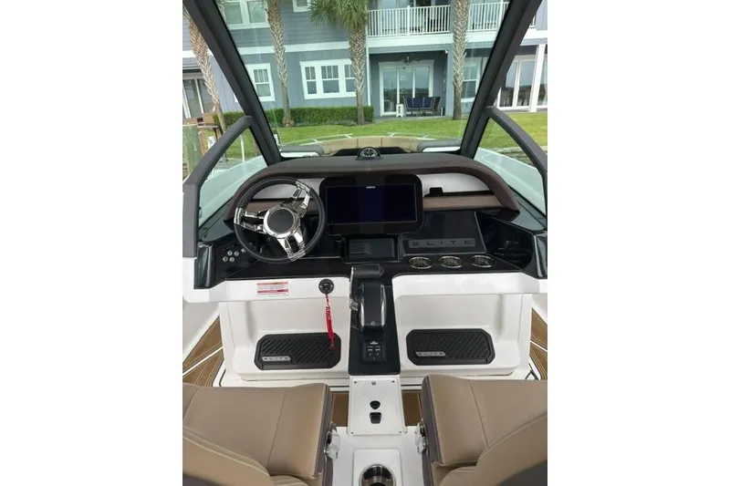 Slide: The Image of 2025 Monterey Elite 27 OB boat dashboard with modern controls and steering wheel. - 40