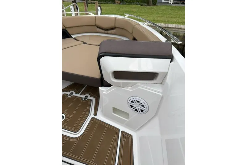 Slide: The Image of 2025 Monterey Elite 27 OB boat interior with tan seating and speaker system. - 48