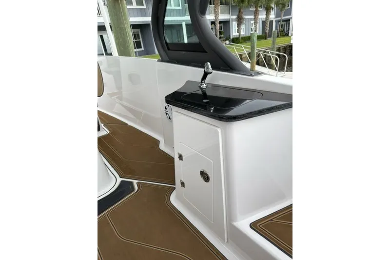 Slide: The Image of 2025 Monterey Elite 27 OB boat interior with sleek sink and modern design. - 49