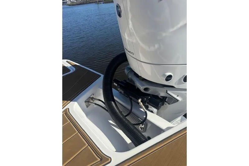 Slide: The Image of 2025 Monterey Elite 27 OB boat engine detail by the water. - 58