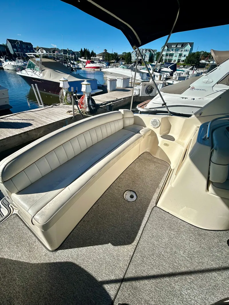 Slide: The Image of 2002 Rinker 342 Fiesta Vee boat interior with seating, docked at marina. - 19