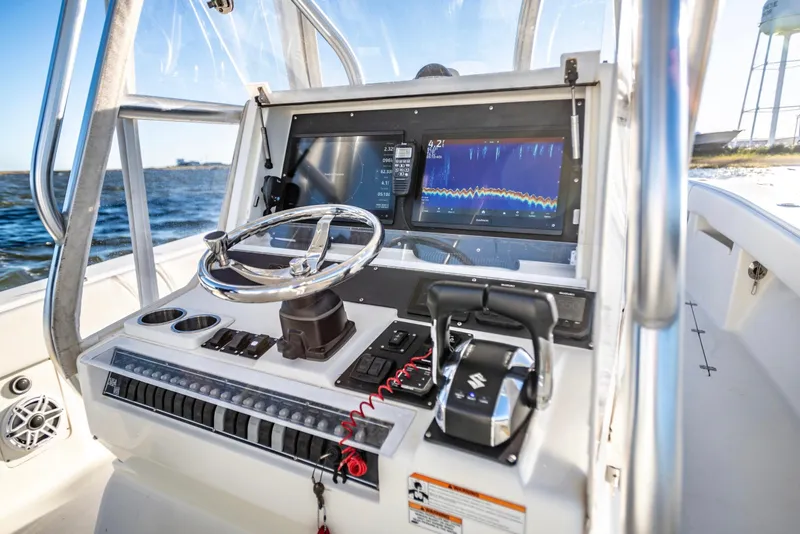 Slide: The Image of 2012 SeaVee 340B boat dashboard with steering wheel and navigation display. - 11