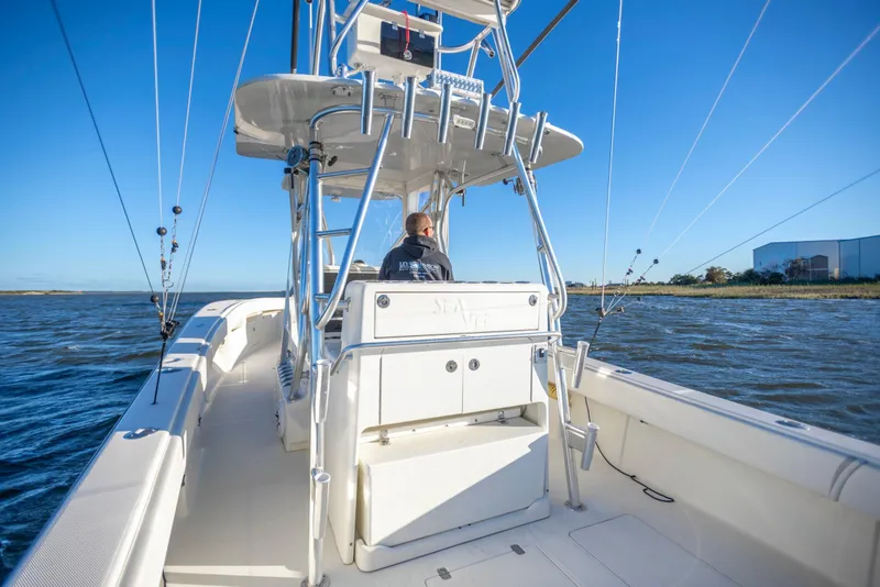 Slide: The Image of 2012 SeaVee 340B boat cruising on open water under clear blue sky. - 15
