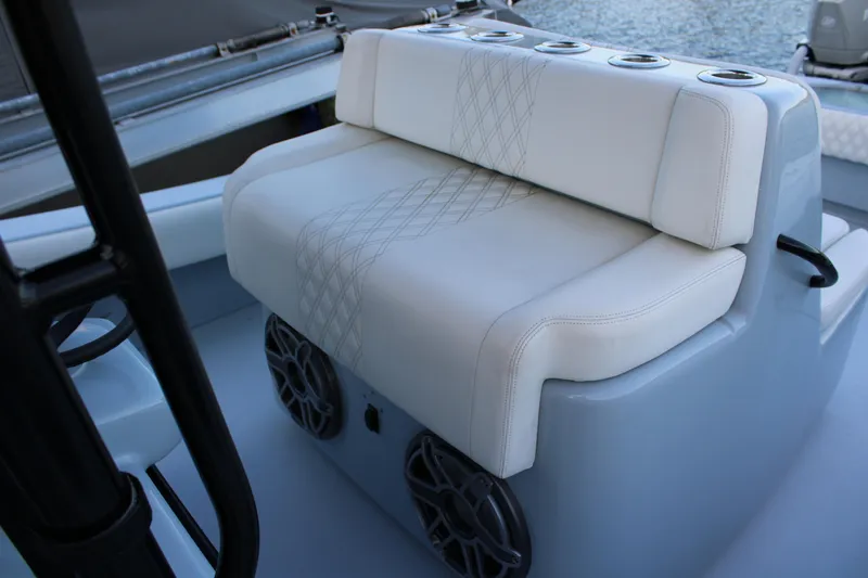 Slide: The Image of Luxury seating on 2019 Conch 33 boat with cup holders and speakers. - 12