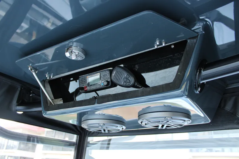 Slide: The Image of 2019 Conch 33 boat console with radio and speakers. - 16