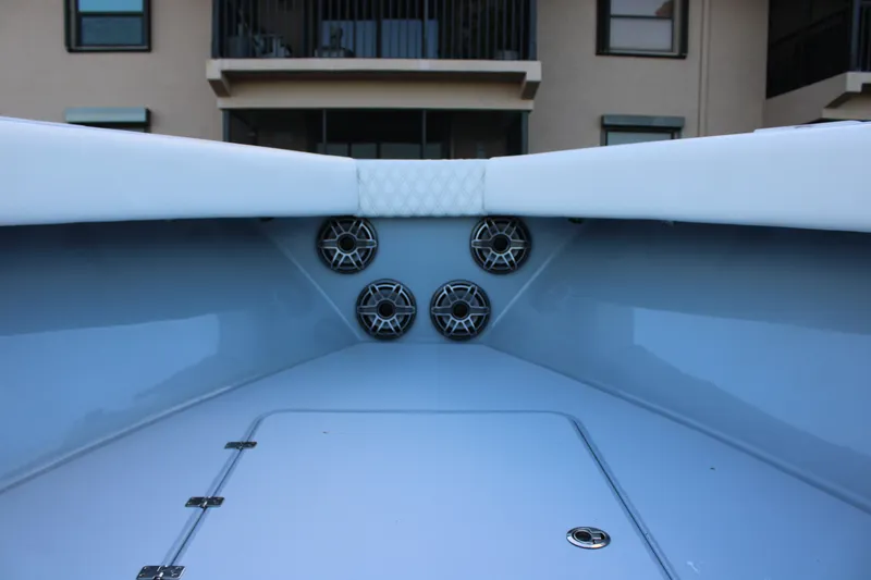 Slide: The Image of Interior view of 2019 Conch 33 boat with speakers and cushioned seating. - 25