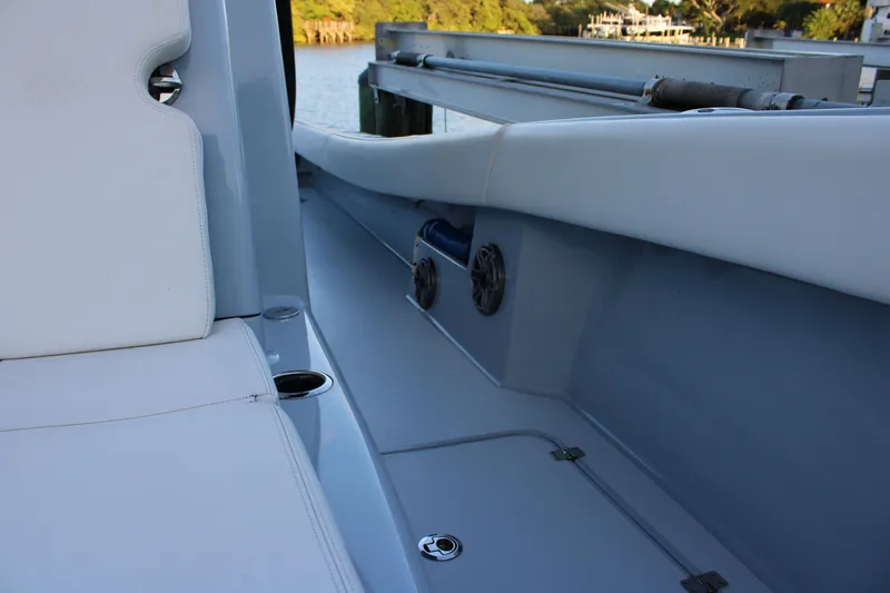 Slide: The Image of 2019 Conch 33 boat interior with white seating and cup holders. - 30