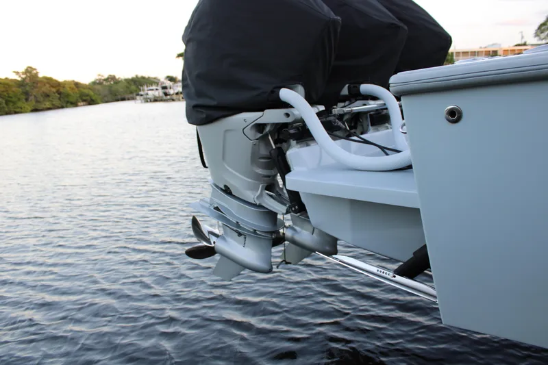 Slide: The Image of 2019 Conch 33 boat engine detail on calm water. - 34