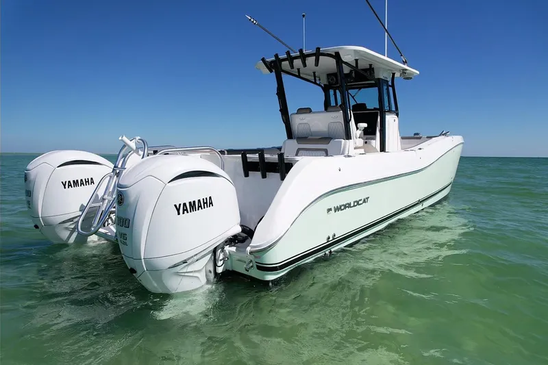 Slide: The Image of 2023 World Cat 325 CC boat with twin Yamaha engines on clear water. - 8