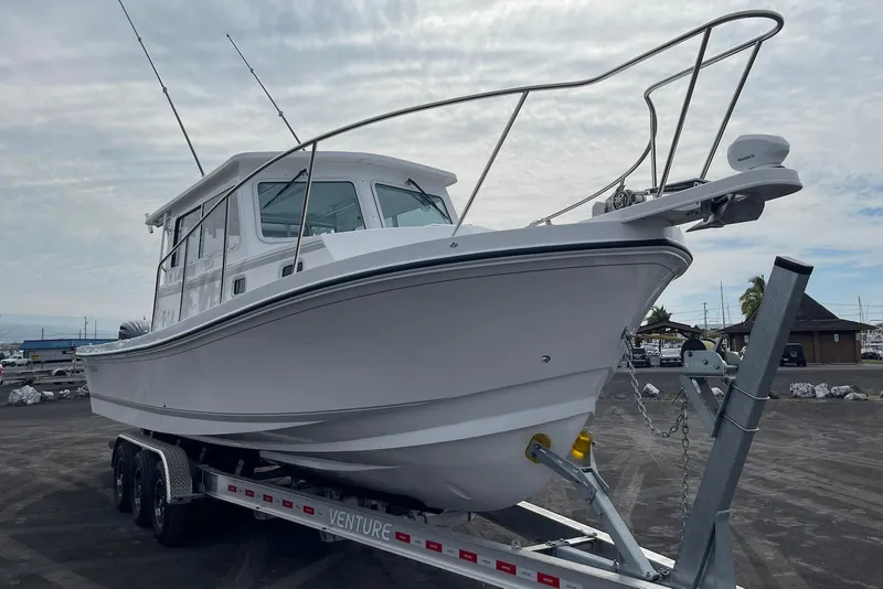Slide: The Image of 2026 Steiger Craft 31 Fisherman boat on trailer, ready for launch. - 11