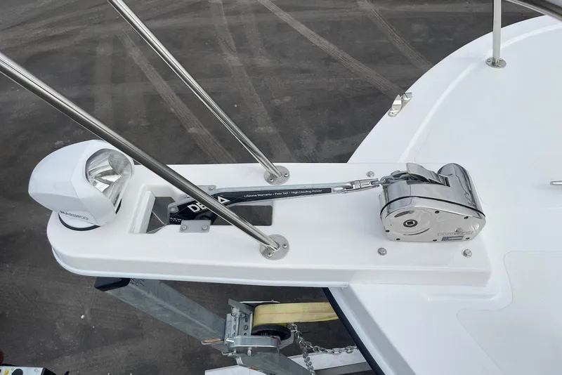 Slide: The Image of 2026 Steiger Craft 31 Fisherman boat anchor system with spotlight and winch. - 12