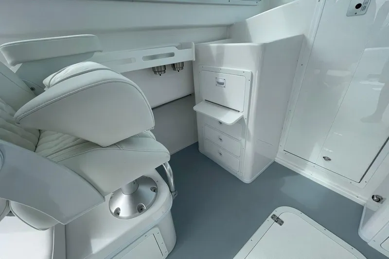 Slide: The Image of Interior of 2026 Steiger Craft 31 Fisherman boat with white seating and storage compartments. - 16