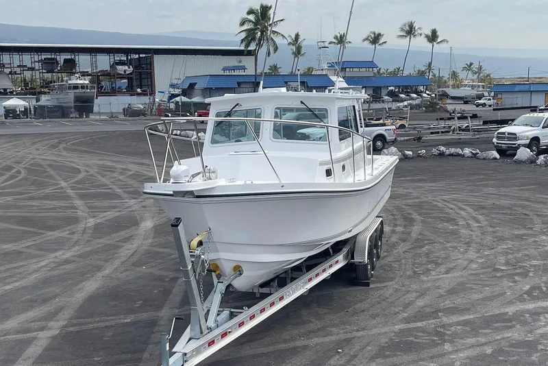 Slide: The Image of 2026 Steiger Craft 31 Fisherman boat on trailer in a marina setting. - 4