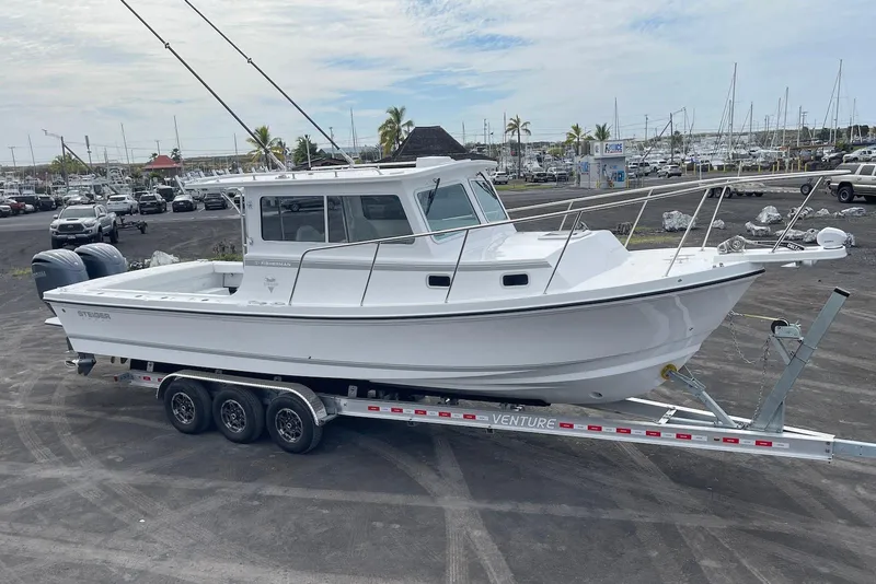 Slide: The Image of 2026 Steiger Craft 31 Fisherman boat on trailer in marina parking lot. - 6