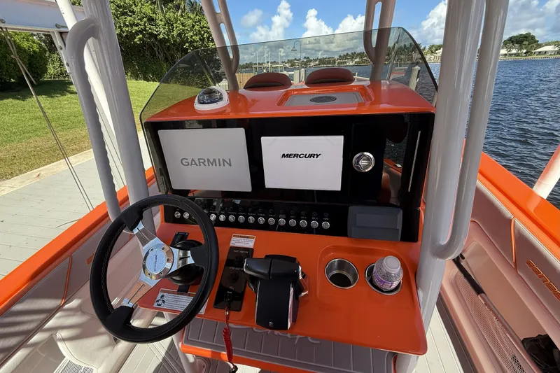 Slide: The Image of Orange helm of 2025 Concept 32' CC boat with Garmin and Mercury displays. - 4