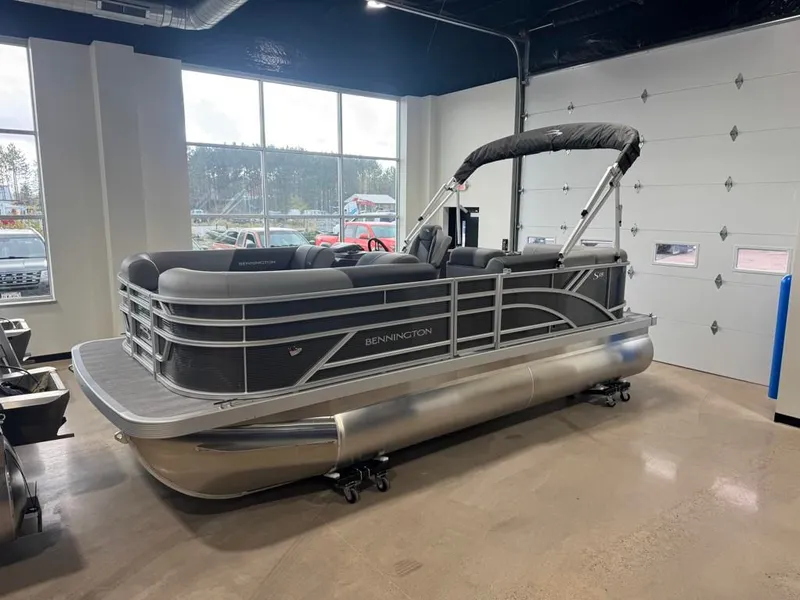 Slide: The Image of 2026 Bennington 188SL pontoon boat in showroom. - 12
