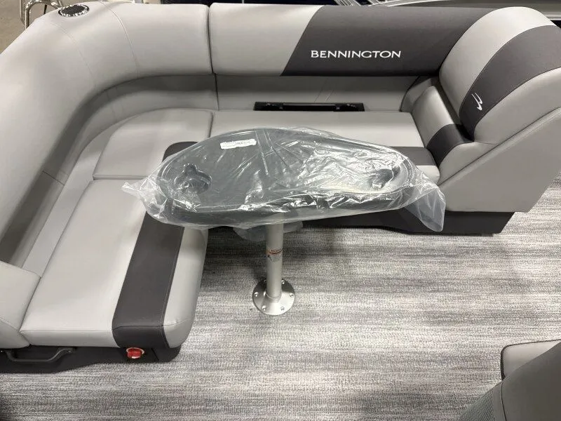 Slide: The Image of Interior of a 2026 Bennington 188SL pontoon boat with gray seating. - 22