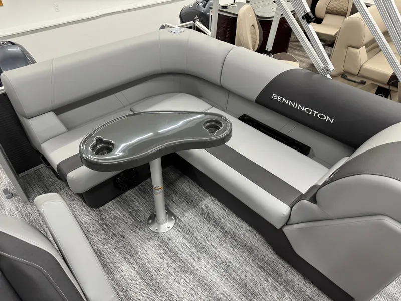 Slide: The Image of Interior of 2026 Bennington 188SL with gray upholstery and table. - 23