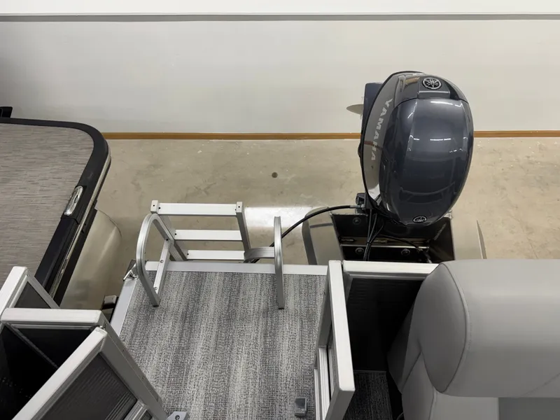 Slide: The Image of Bennington 188SL 2026 with Yamaha motor and gray carpet flooring. - 25