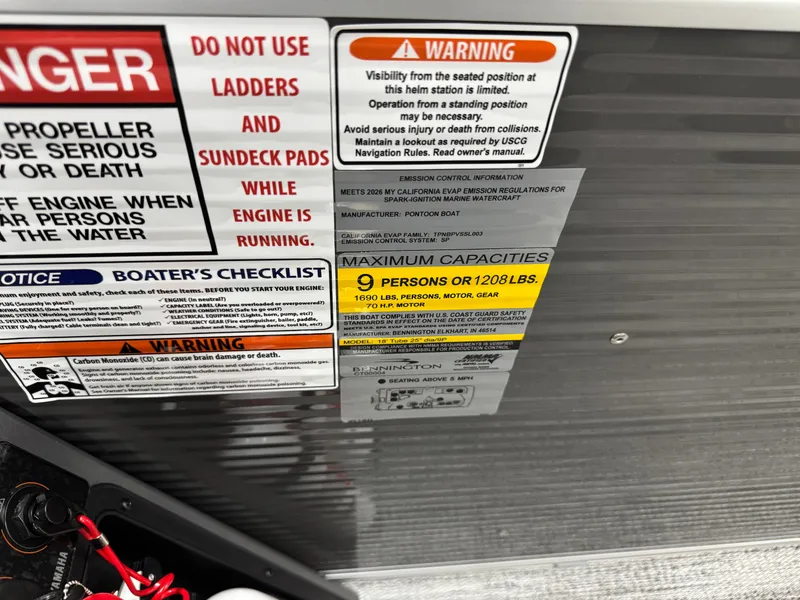 Slide: The Image of Warning labels and capacity details on a Bennington 188SL pontoon boat. - 27