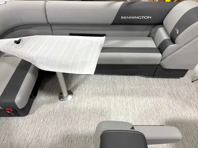 Slide: The Image of Interior of Bennington 20SL 2026 with gray upholstery and table. - 13