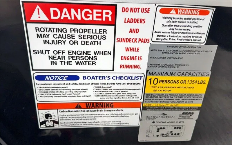 Slide: The Image of Warning labels on a 2026 Bennington 20SL boat. - 14