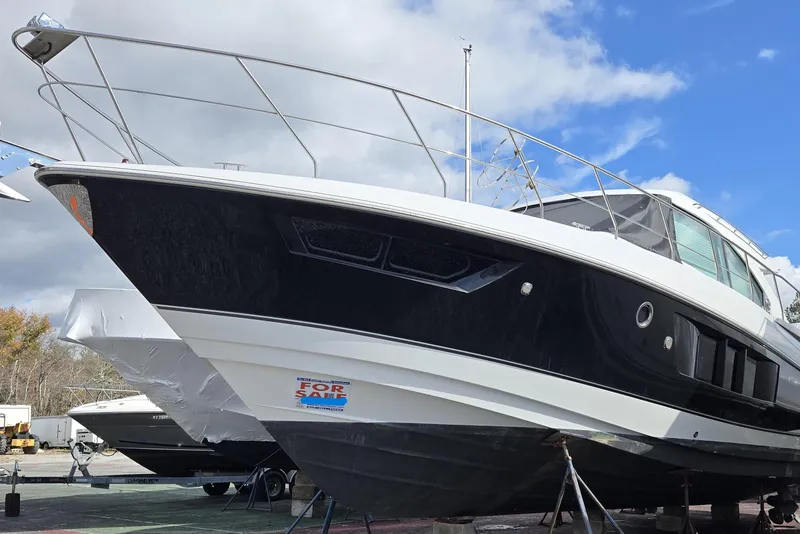 The Image of 2016 Cruisers Sport Series 45 Cantius yacht on dry dock, side view. - 0