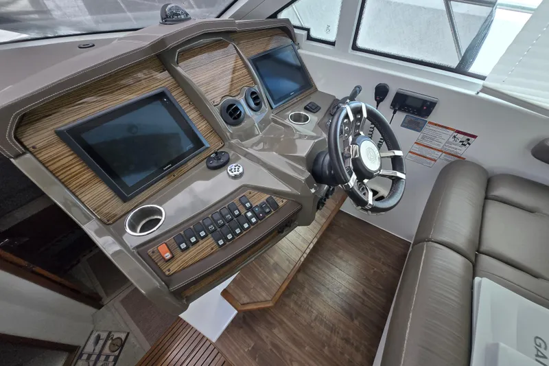 Slide: The Image of Interior helm of 2016 Cruisers Sport Series 45 Cantius with Garmin navigation. - 13