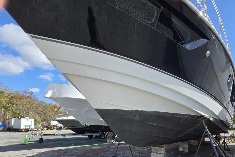 Slide: The Image of 2016 Cruisers Sport Series 45 Cantius yacht interior with seating and bar stools. - 15