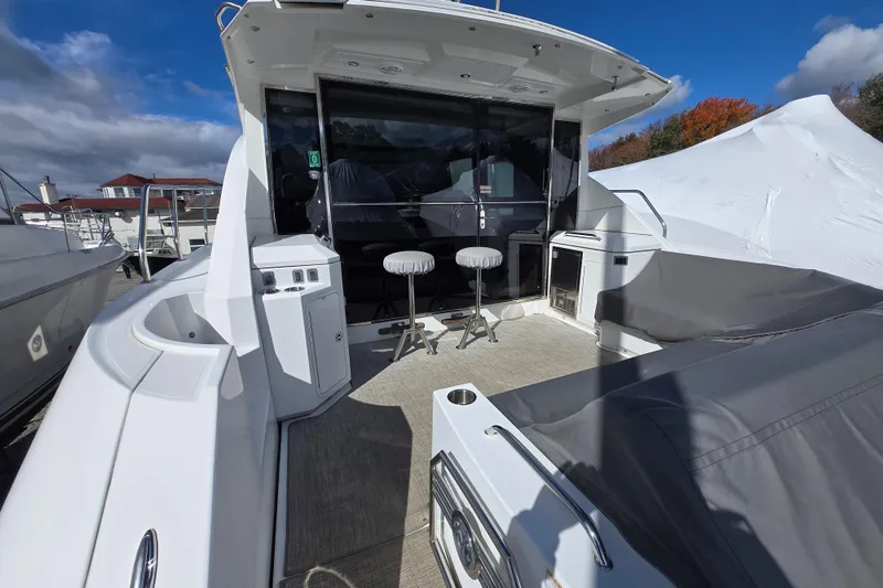 Slide: The Image of 2016 Cruisers Sport Series 45 Cantius yacht docked, showcasing sleek design and modern features. - 18