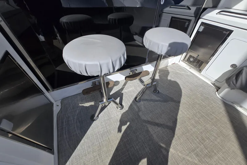 Slide: The Image of 2016 Cruisers Sport Series 45 Cantius yacht deck with seating and storage. - 24