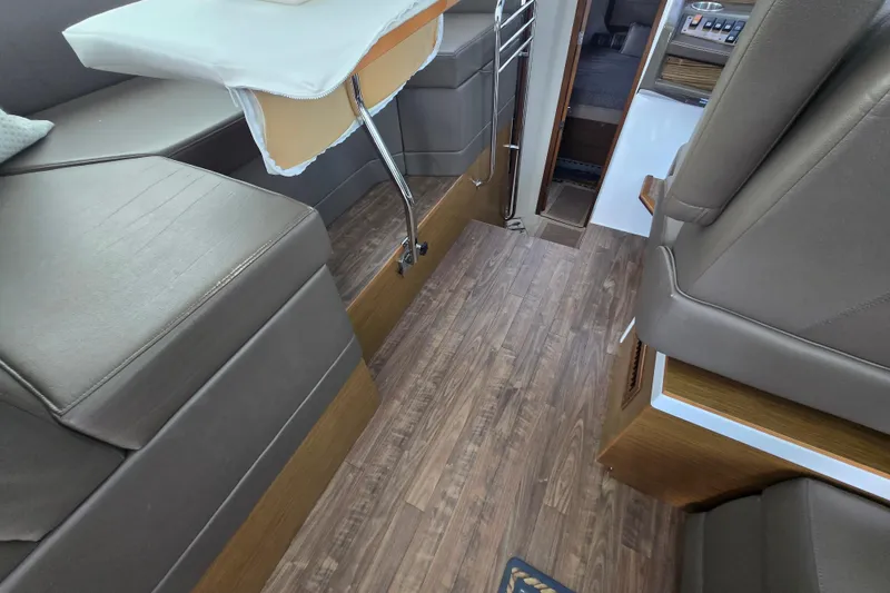 Slide: The Image of Interior of 2016 Cruisers Sport Series 45 Cantius with leather seating and decorative pillow. - 30