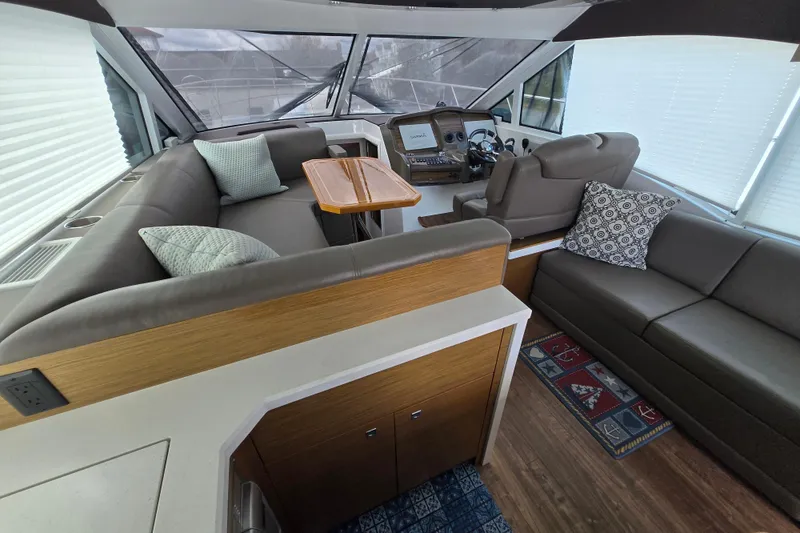 Slide: The Image of Interior of 2016 Cruisers Sport Series 45 Cantius yacht with cozy seating area. - 31
