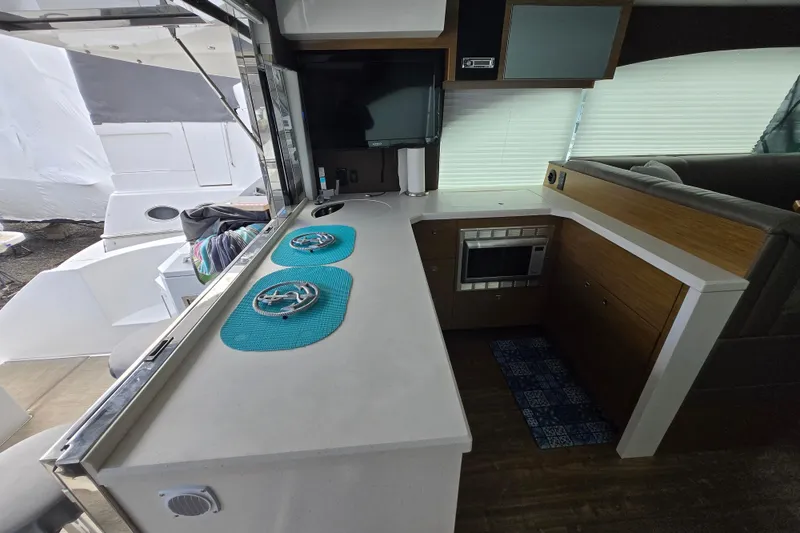 Slide: The Image of Interior of 2016 Cruisers Sport Series 45 Cantius yacht with modern seating and helm. - 33