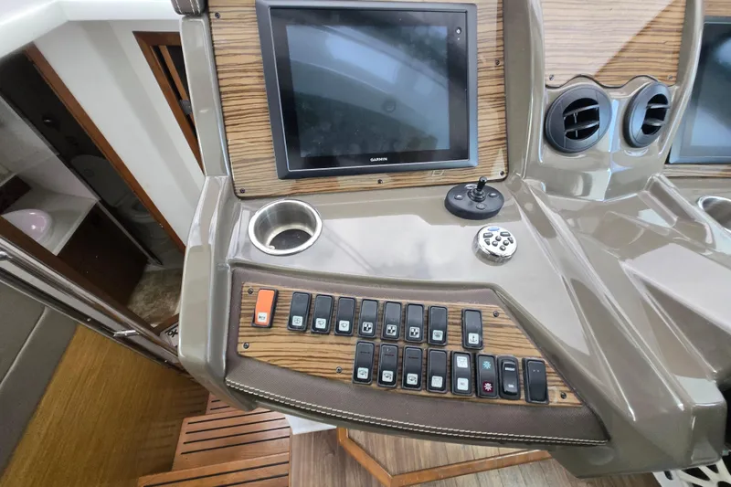 Slide: The Image of Interior of 2016 Cruisers Sport Series 45 Cantius yacht with modern seating and kitchen area. - 36