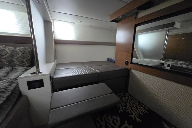 Slide: The Image of Interior cabin of 2016 Cruisers Sport Series 45 Cantius yacht, featuring a cozy bed. - 46