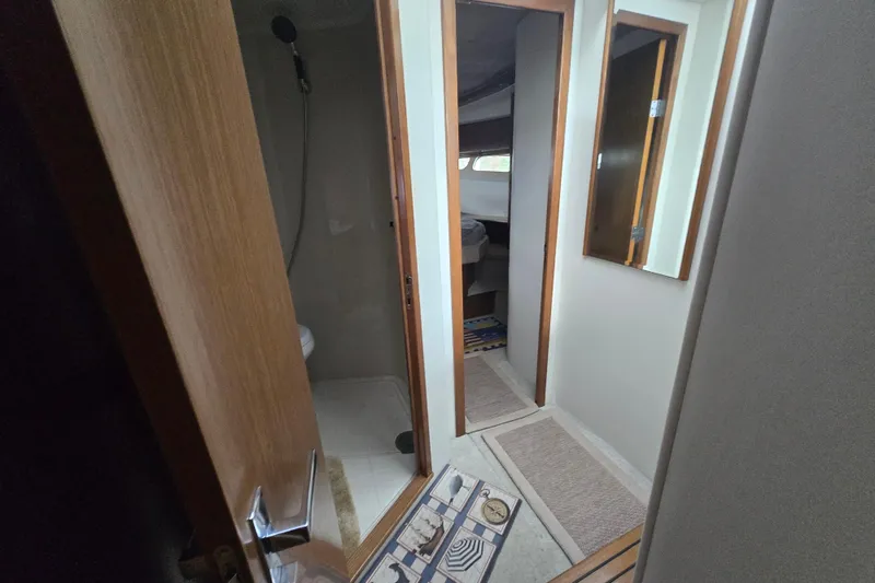 Slide: The Image of 2016 Cruisers Sport Series 45 Cantius interior with wood paneling and stereo system. - 49