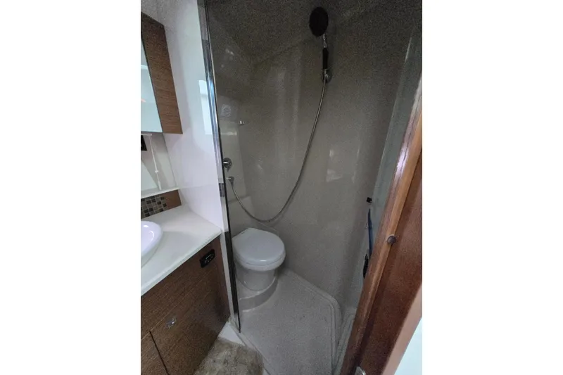 Slide: The Image of Bathroom interior of 2016 Cruisers Sport Series 45 Cantius yacht, featuring sink and toilet. - 52