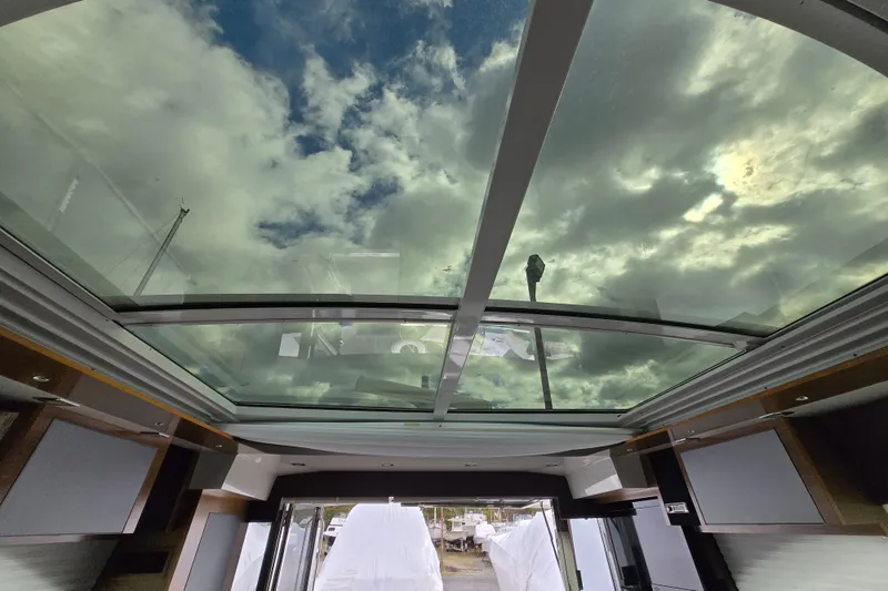Slide: The Image of Bathroom interior of 2016 Cruisers Sport Series 45 Cantius yacht, featuring a compact toilet. - 53