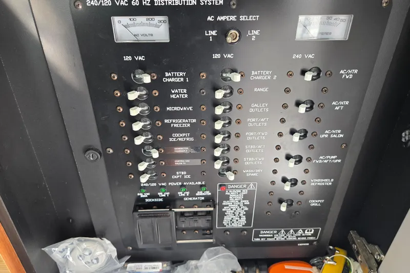 Slide: The Image of Electrical panel inside 2016 Cruisers Sport Series 45 Cantius yacht, showcasing control switches. - 56