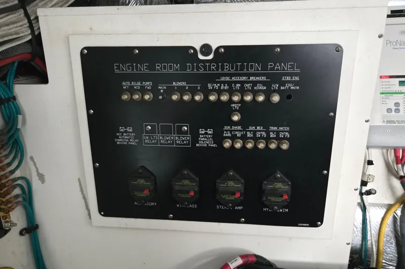 Slide: The Image of Engine room of 2016 Cruisers Sport Series 45 Cantius with visible machinery and wiring. - 65