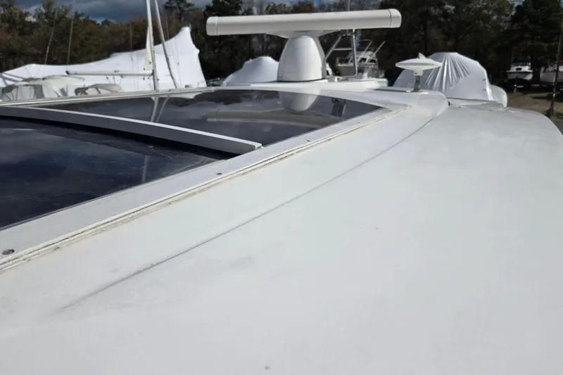 Slide: The Image of 2016 Cruisers Sport Series 45 Cantius yacht deck with sleek design and railing. - 70